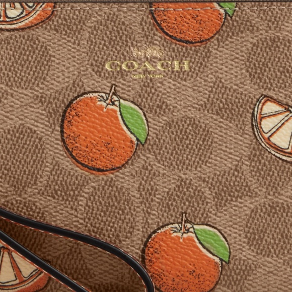Corner Zip Wristlet In Signature Canvas With Orange Print - Picture 1 of 3